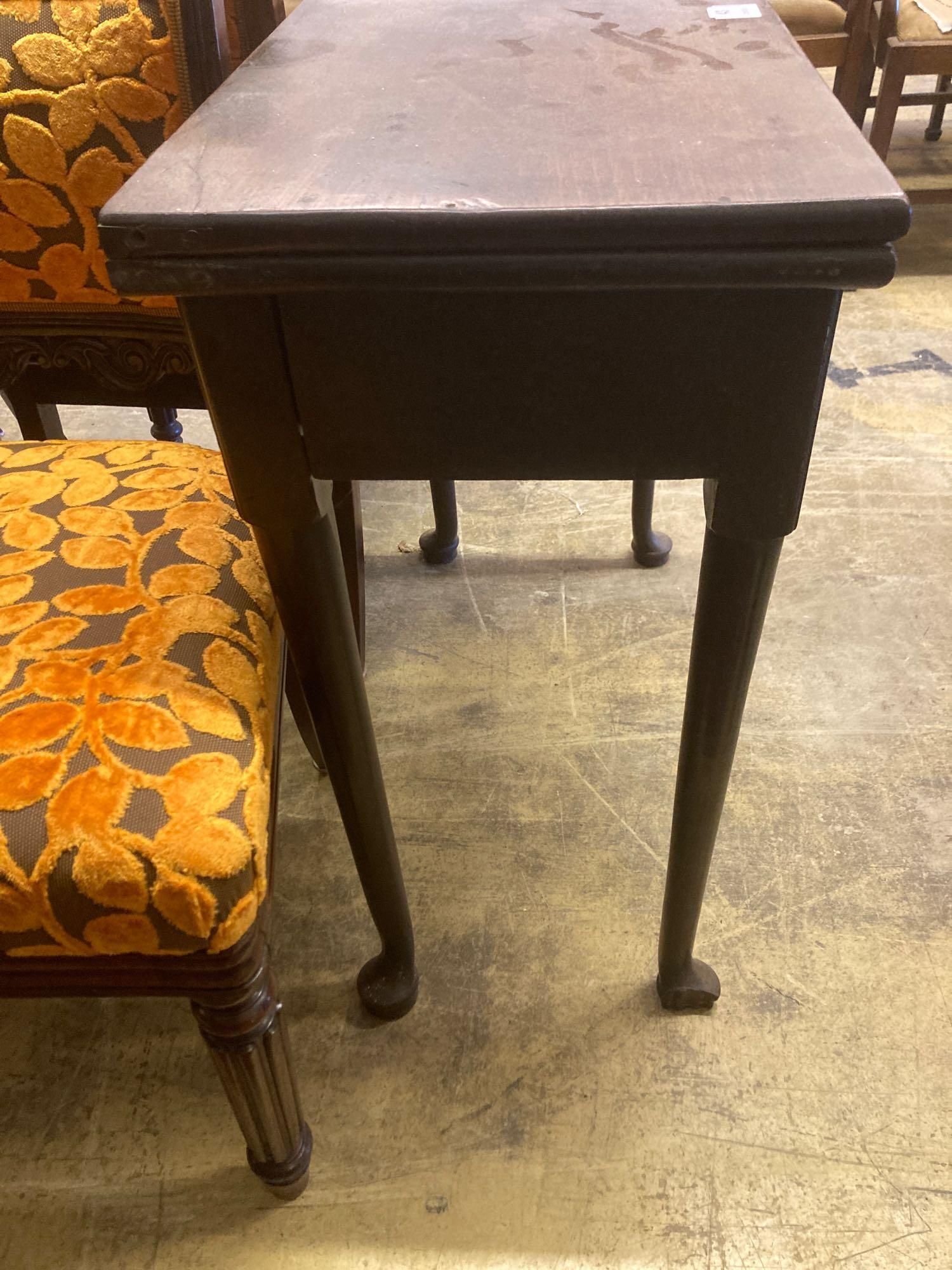 A mid 18th century mahogany folding top tea table, with frieze drawer, width 76cm